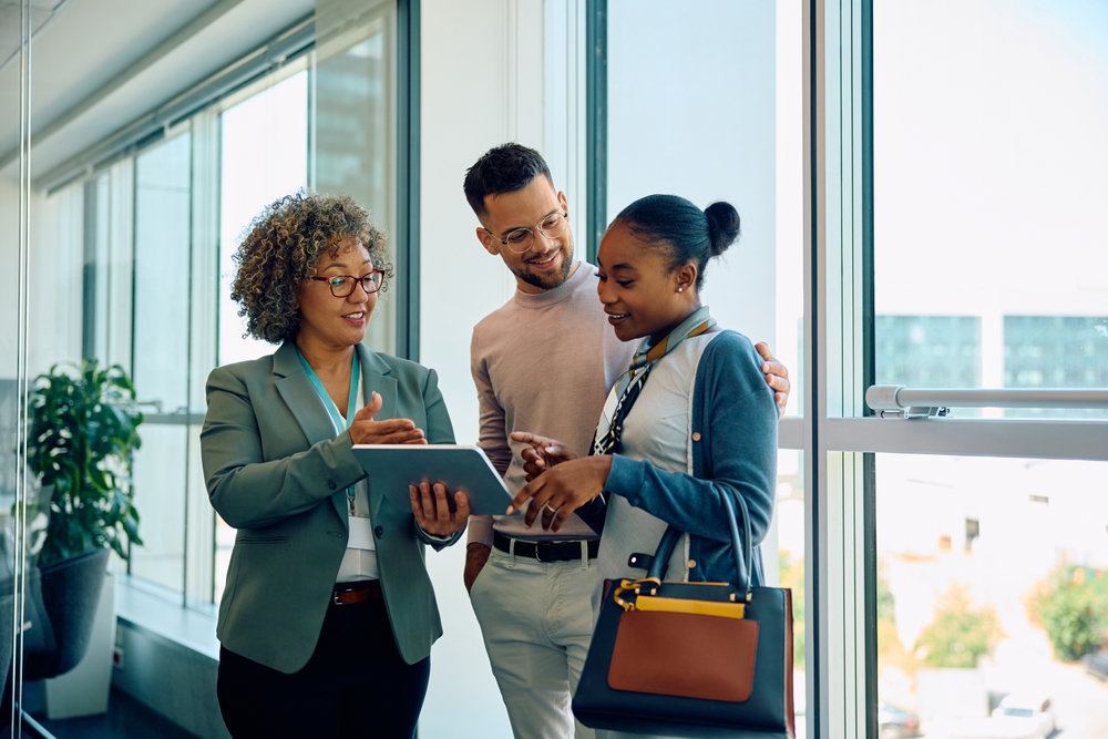 Business owners reviewing their policy with their business owner insurance agent 